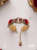 Sundarasūra- Beautiful Wine- Bracelet with rich hue of the red stones and twisted thread work.