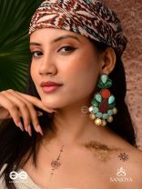 Vikṛtiśīla- Elegant Form-Chunky blue, green, and rust-colored stones with a distinctive golden-silver leaflet design