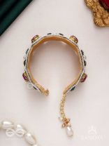 Tarangini-Wavy beauty-opulent bracelet embedded with purple and green stones