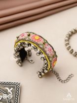 SUMANALEKHA-FLORAL PATTERN- SEMI-OXIDIZED BRACELET FEATURES GHUNGROO, BEADS, AND EMBROIDERED FLOWERS