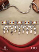  SANGRAHITAVARNA- COLLECTED HUES- ENAMELLED OXIDIZED CHOKER NECKPIECE IN PASTEL HUES WITH COWRIE SHELLS, GHUNGROOS AND MIRRORWORK