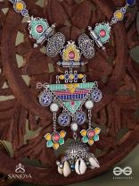 Rangapadma-Color bloom- Enamelled Neckpiece with cowrie shells,mirror and colorful gemstones on oxidized metalwork.