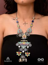 Rangapadma-Color bloom- Enamelled Neckpiece with cowrie shells,mirror and colorful gemstones on oxidized metalwork.