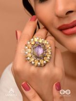 KANAKA PUSHPA – GOLDEN FLOWER EMBROIDERED FLOWER-SHAPED RING ADORNED WITH YELLOW GEMS AND PEARLS, GIVING A GOLDEN GLOW