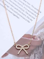 TIED IN GOLD- MINIMALIST BOW NECKPIECE