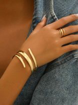 AURIC SWIRL - CONTEMPORARY GOLDEN TWIST RING+ TWISTED GLEAM- SLEEK AND POLISHED METALLIC CUFF BRACELET