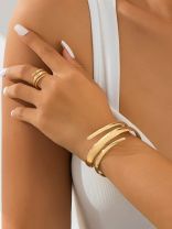 AURIC SWIRL - CONTEMPORARY GOLDEN TWIST RING+ TWISTED GLEAM- SLEEK AND POLISHED METALLIC CUFF BRACELET