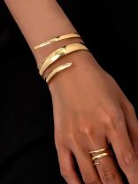 AURIC SWIRL - CONTEMPORARY GOLDEN TWIST RING+ TWISTED GLEAM- SLEEK AND POLISHED METALLIC CUFF BRACELET