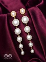 Elegance is a deadly weapon- white pearls statement earrings