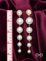 Elegance is a deadly weapon- white pearls statement earrings