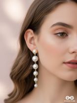 Elegance is a deadly weapon- white pearls statement earrings