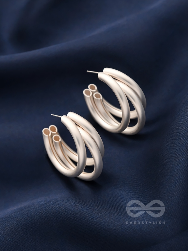 THE ELEGANT TURNS - MATTE FINISHED SILVER HOOPS