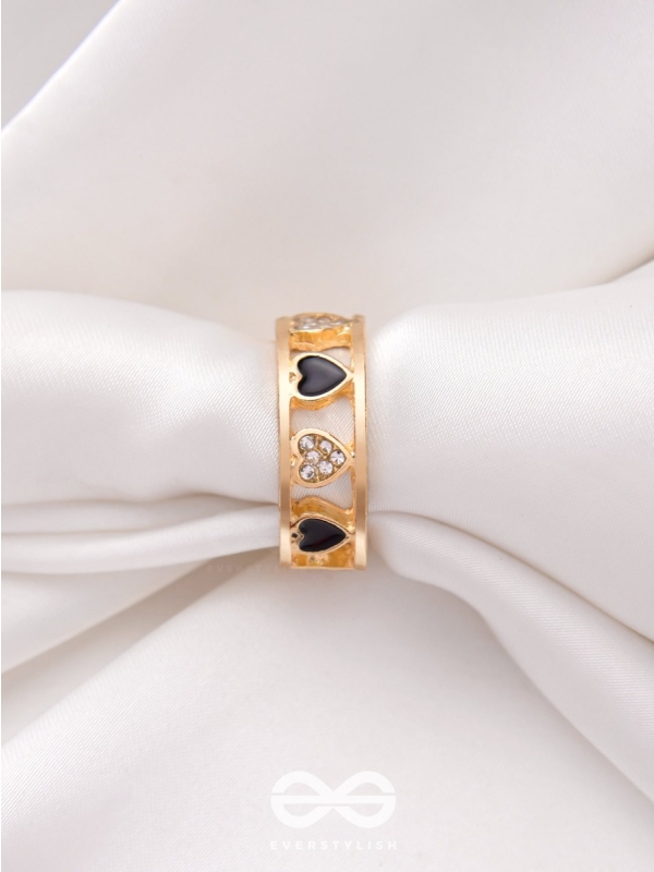 ENVELOPED IN HEARTS - GOLDEN STATEMENT RING (BLACK)