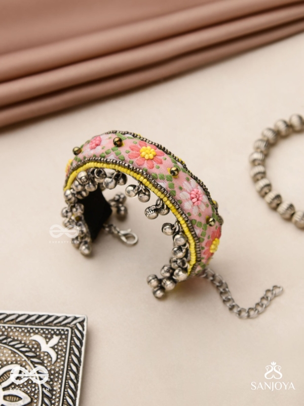 SUMANALEKHA-FLORAL PATTERN- SEMI-OXIDIZED BRACELET FEATURES GHUNGROO, BEADS, AND EMBROIDERED FLOWERS
