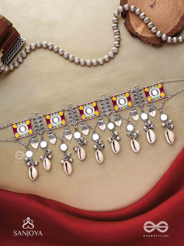  SANGRAHITAVARNA- COLLECTED HUES- ENAMELLED OXIDIZED CHOKER NECKPIECE IN PASTEL HUES WITH COWRIE SHELLS, GHUNGROOS AND MIRRORWORK