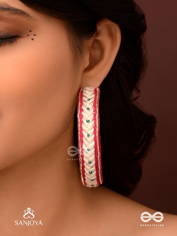 Vasantiruchi- Spring Charm- Embroidered earrings with red and white threads, decorated with beads and gold accents