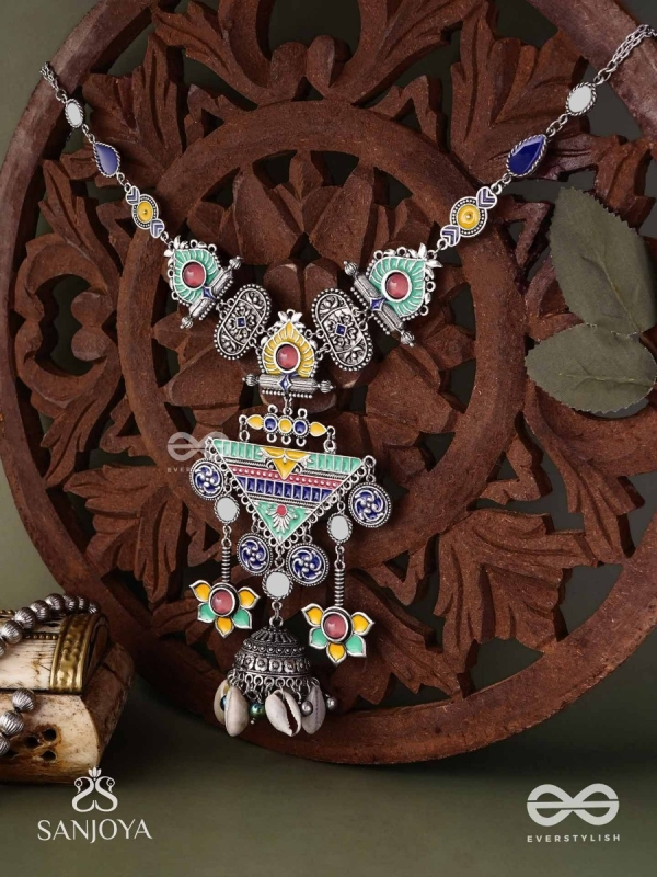 Rangapadma-Color bloom- Enamelled Neckpiece with cowrie shells,mirror and colorful gemstones on oxidized metalwork.