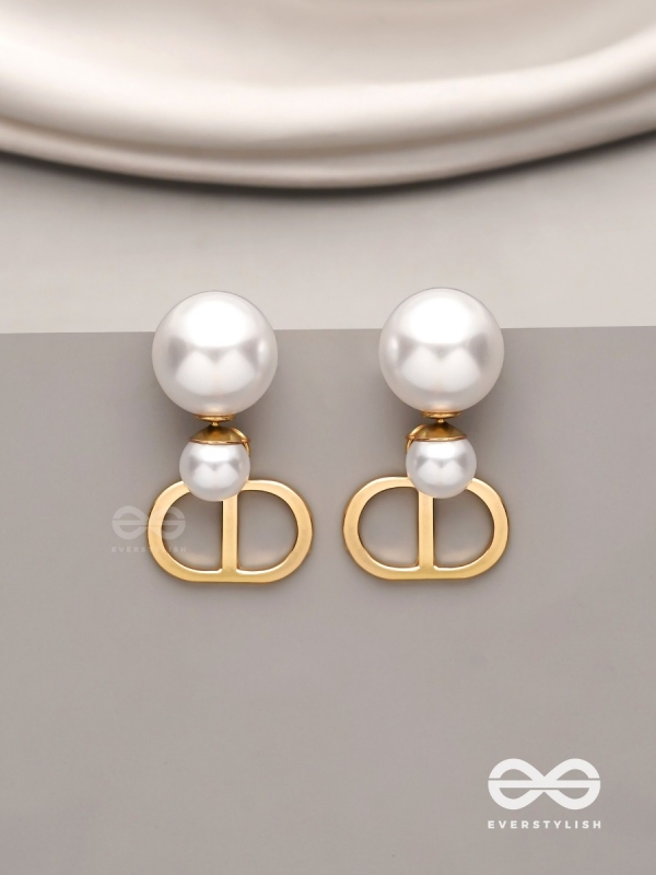 Starlit orb- dangling pearl earrings with golden spheres 
