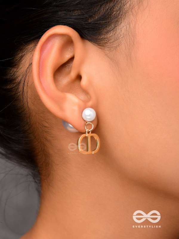 Starlit orb- dangling pearl earrings with golden spheres 