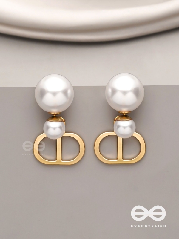 Starlit orb- dangling pearl earrings with golden spheres 