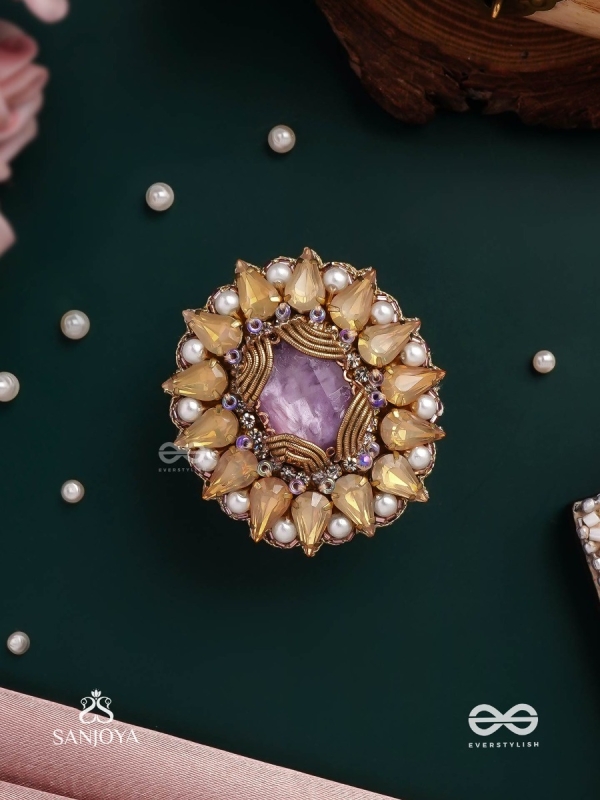 KANAKA PUSHPA – GOLDEN FLOWER EMBROIDERED FLOWER-SHAPED RING ADORNED WITH YELLOW GEMS AND PEARLS, GIVING A GOLDEN GLOW