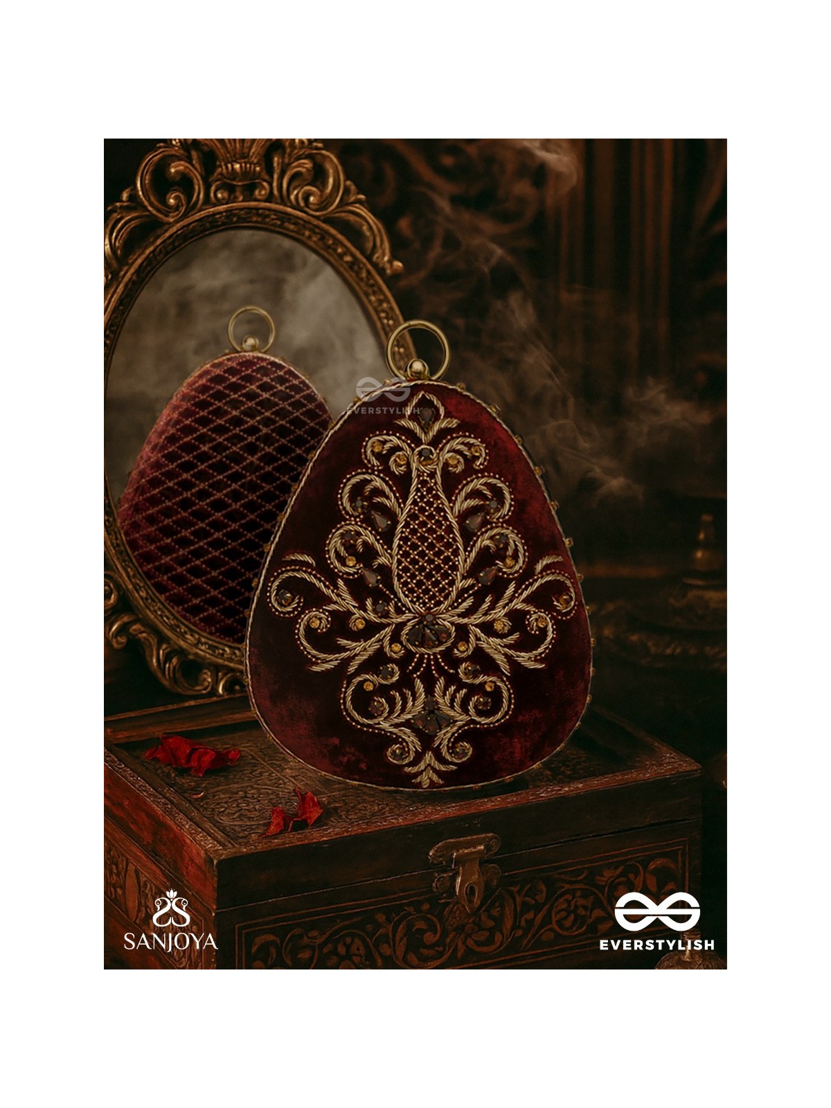 NOOR – OVAL MAROON VELVET CLUTCH WITH RICH ZARDOZI EMBROIDERY AND GOLDEN METAL FRAME