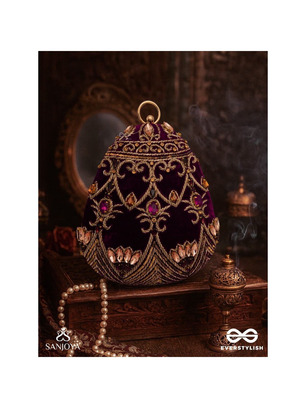 ZEENAT – OVAL DARK PINK VELVET CLUTCH WITH DETAILED EMBELLISHMENT AND GOLDEN METAL FRAME