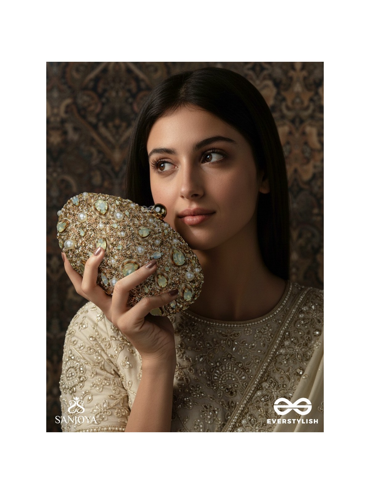 CHANDRAAYA – POLISHED OVAL GOLDEN BRONZE SILK CLUTCH WITH INTRICATE JEWEL STONE EMBELLISHMENT AND GOLDEN METAL FRAME