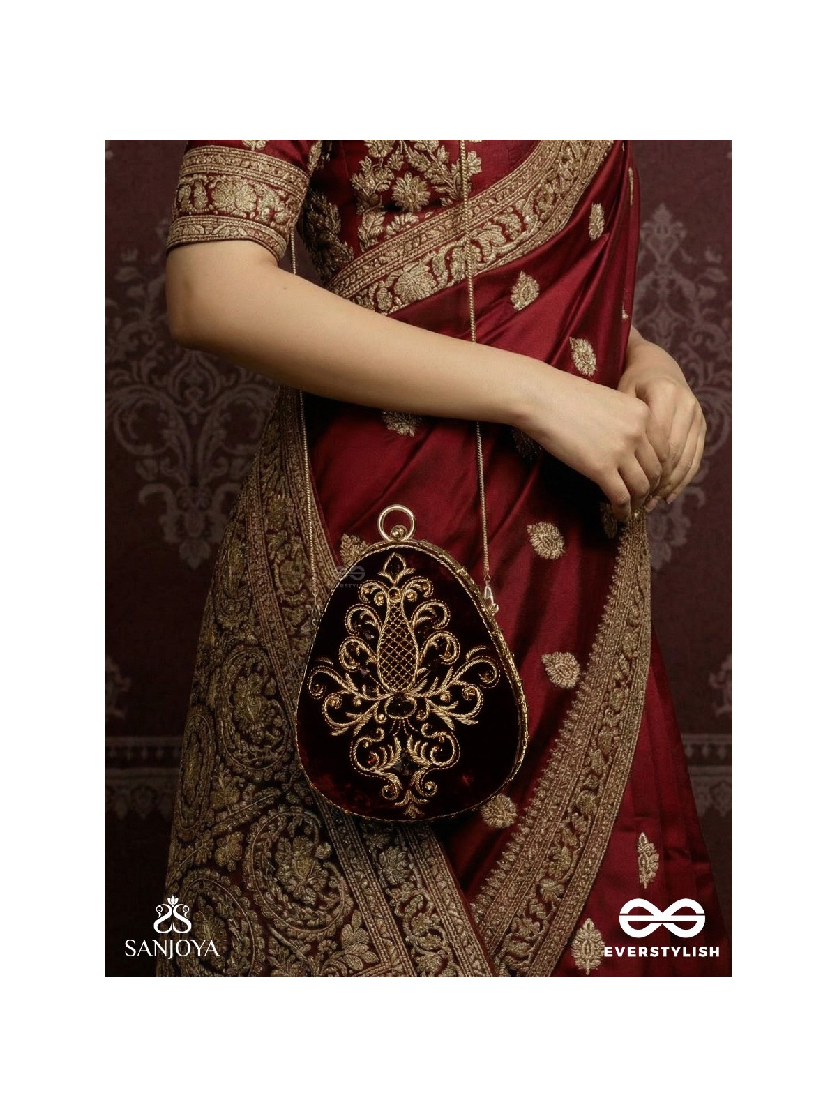 NOOR – OVAL MAROON VELVET CLUTCH WITH RICH ZARDOZI EMBROIDERY AND GOLDEN METAL FRAME