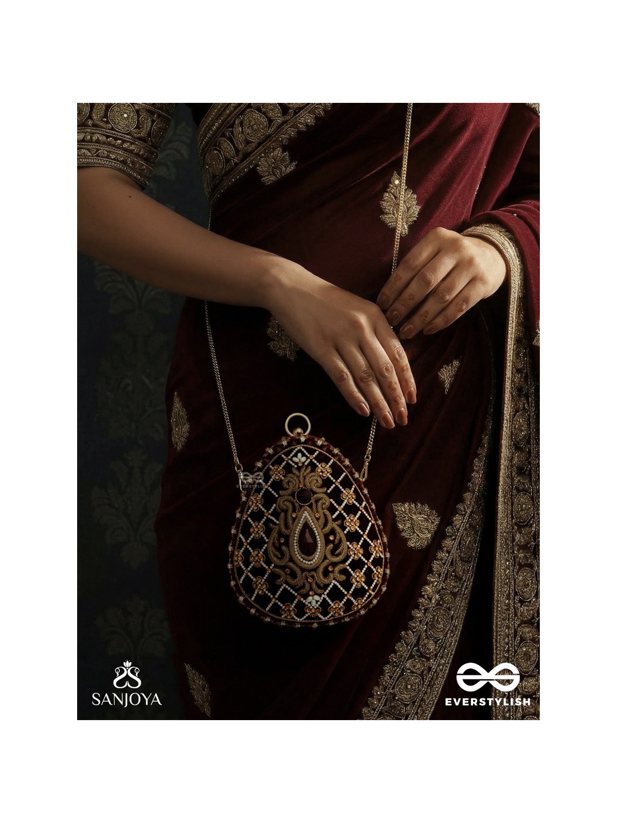 SHAHNAZ – OVAL MAROON VELVET CLUTCH WITH INTRICATE ZARDOZI EMBROIDERY AND GOLDEN METAL FRAME