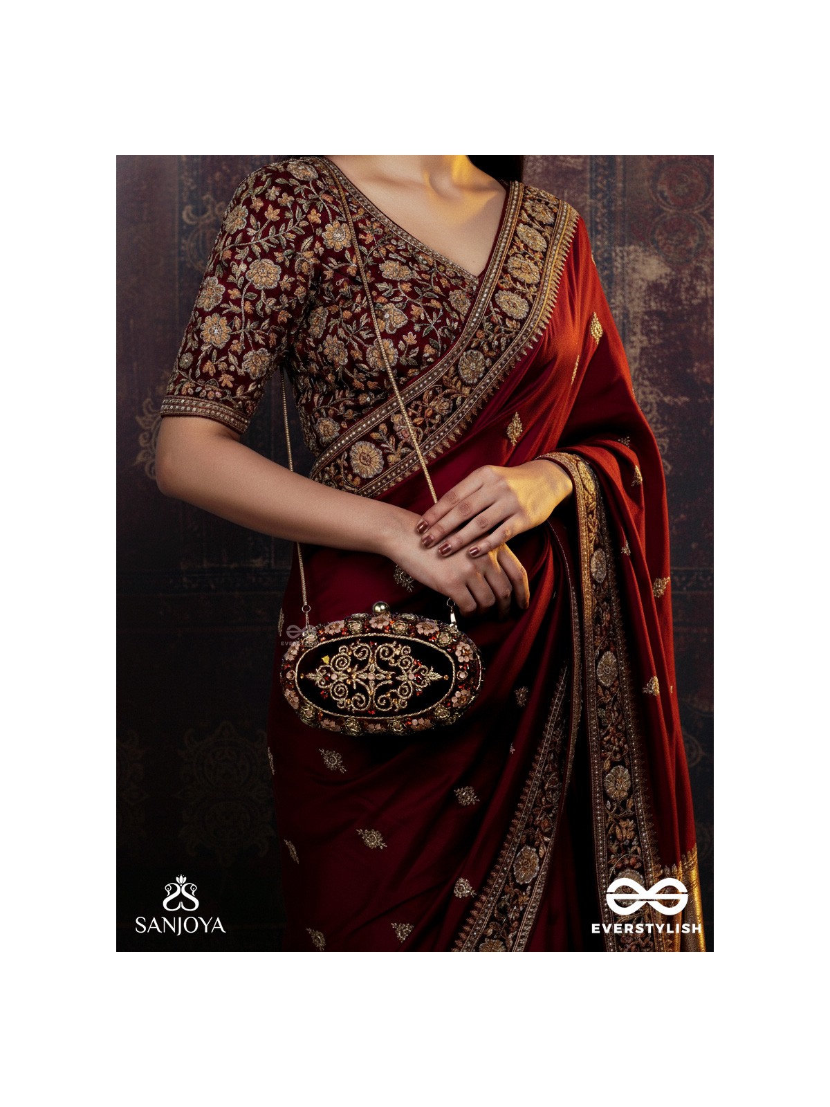 ZEVARIYA – HEIRLOOM-STYLE OVAL CLUTCH WITH INTRICATE ZARI DETAILING AND GOLDEN METAL FRAME