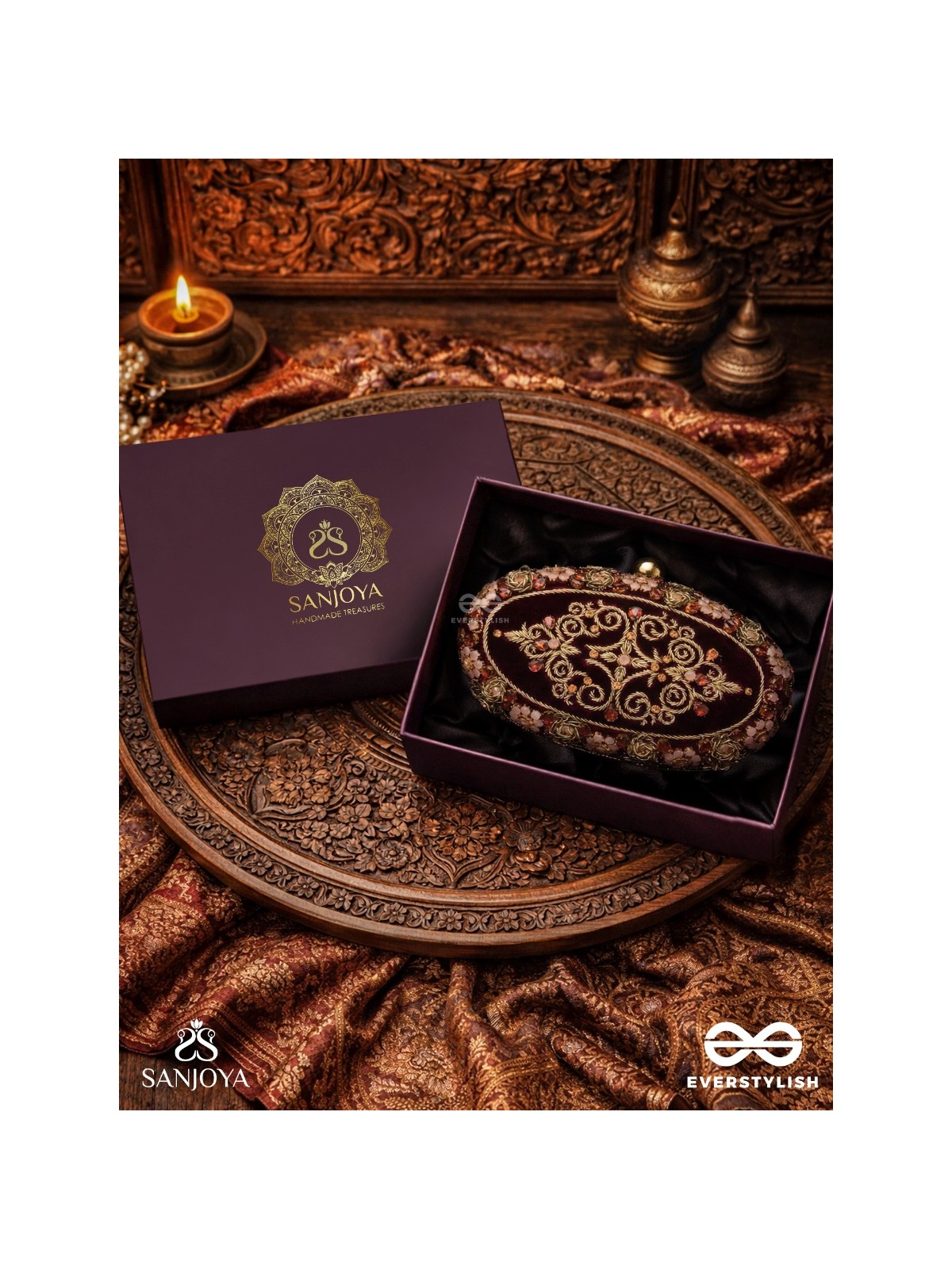ZEVARIYA – HEIRLOOM-STYLE OVAL CLUTCH WITH INTRICATE ZARI DETAILING AND GOLDEN METAL FRAME