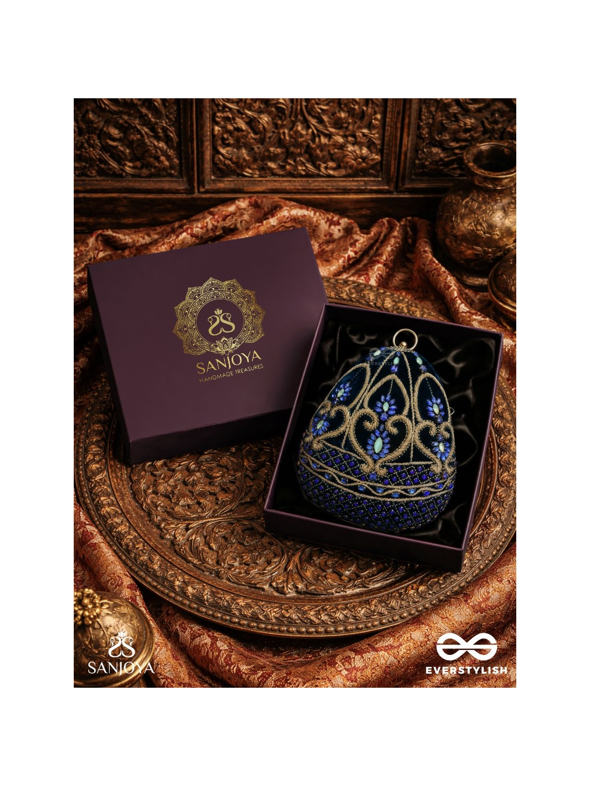 SITARAA – POLISHED OVAL ROYAL BLUE VELVET CLUTCH WITH STONE-ACCENTED HANDWORK AND GOLDEN METAL FRAME