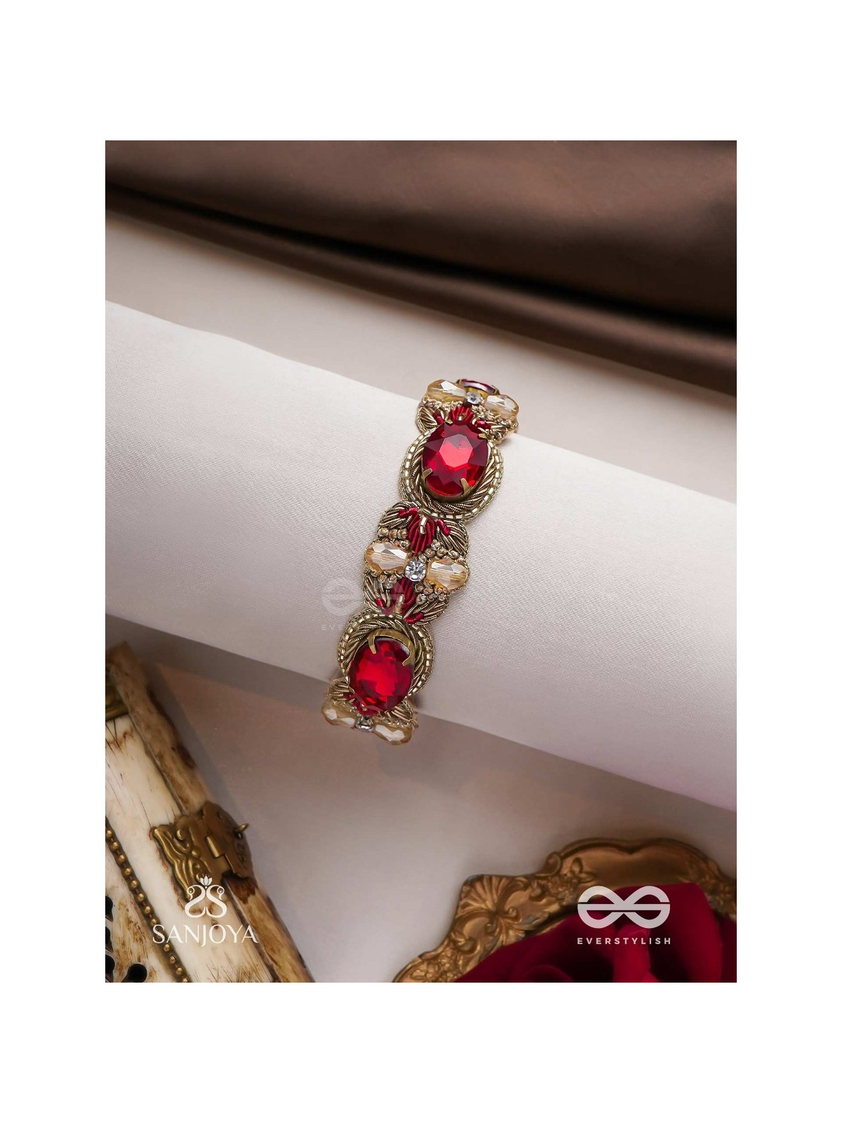Sundarasūra- Beautiful Wine- Bracelet with rich hue of the red stones and twisted thread work.