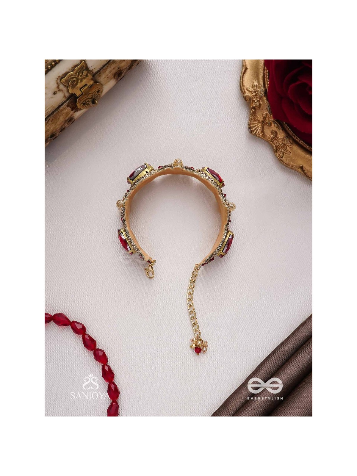 Sundarasūra- Beautiful Wine- Bracelet with rich hue of the red stones and twisted thread work.
