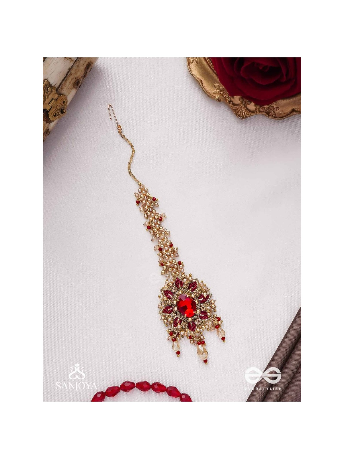 Kumudinikunda-Delicate lotus-Embroidered hair accessory with a red stone & golden embellishments