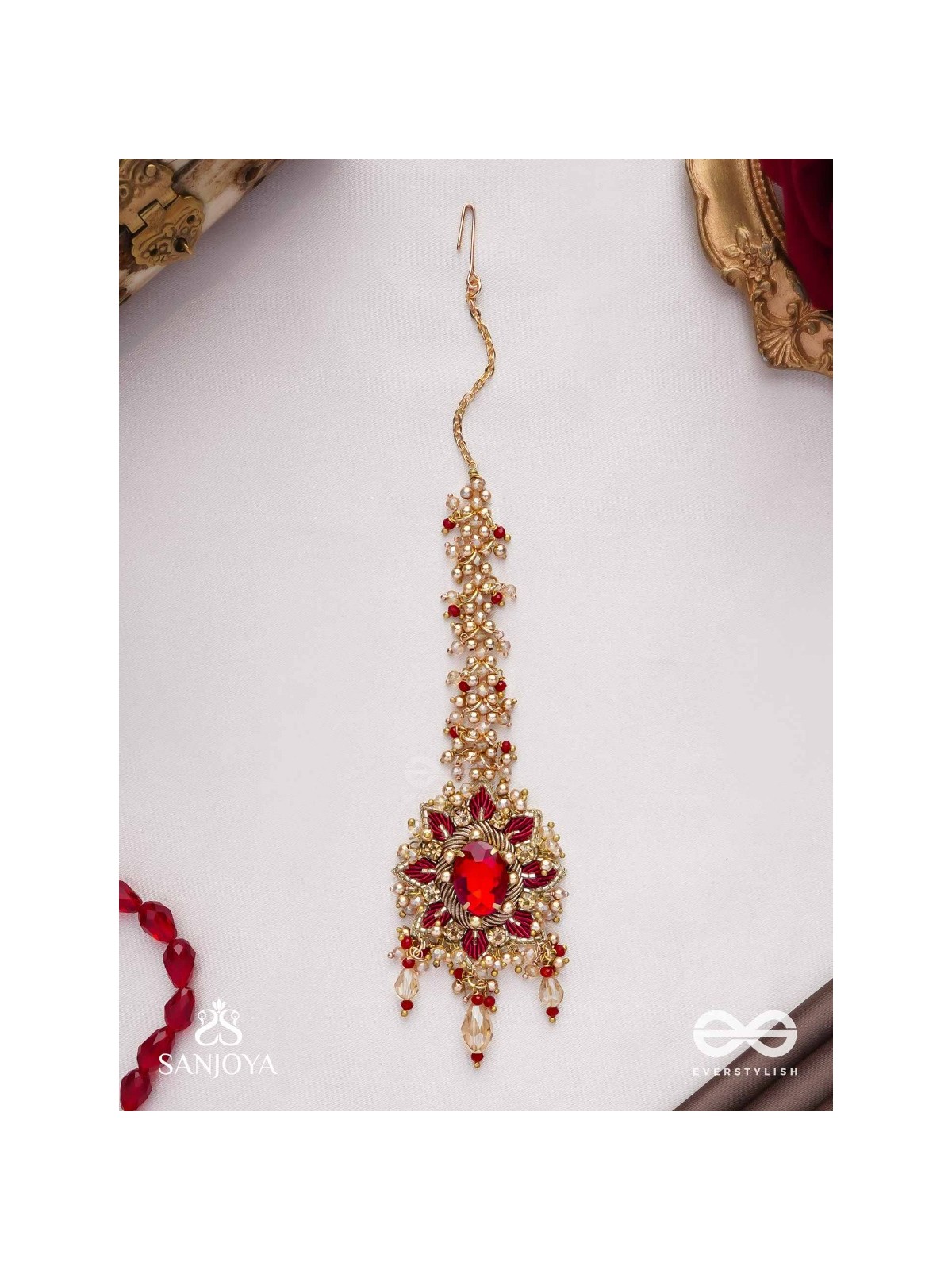Kumudinikunda-Delicate lotus-Embroidered hair accessory with a red stone & golden embellishments