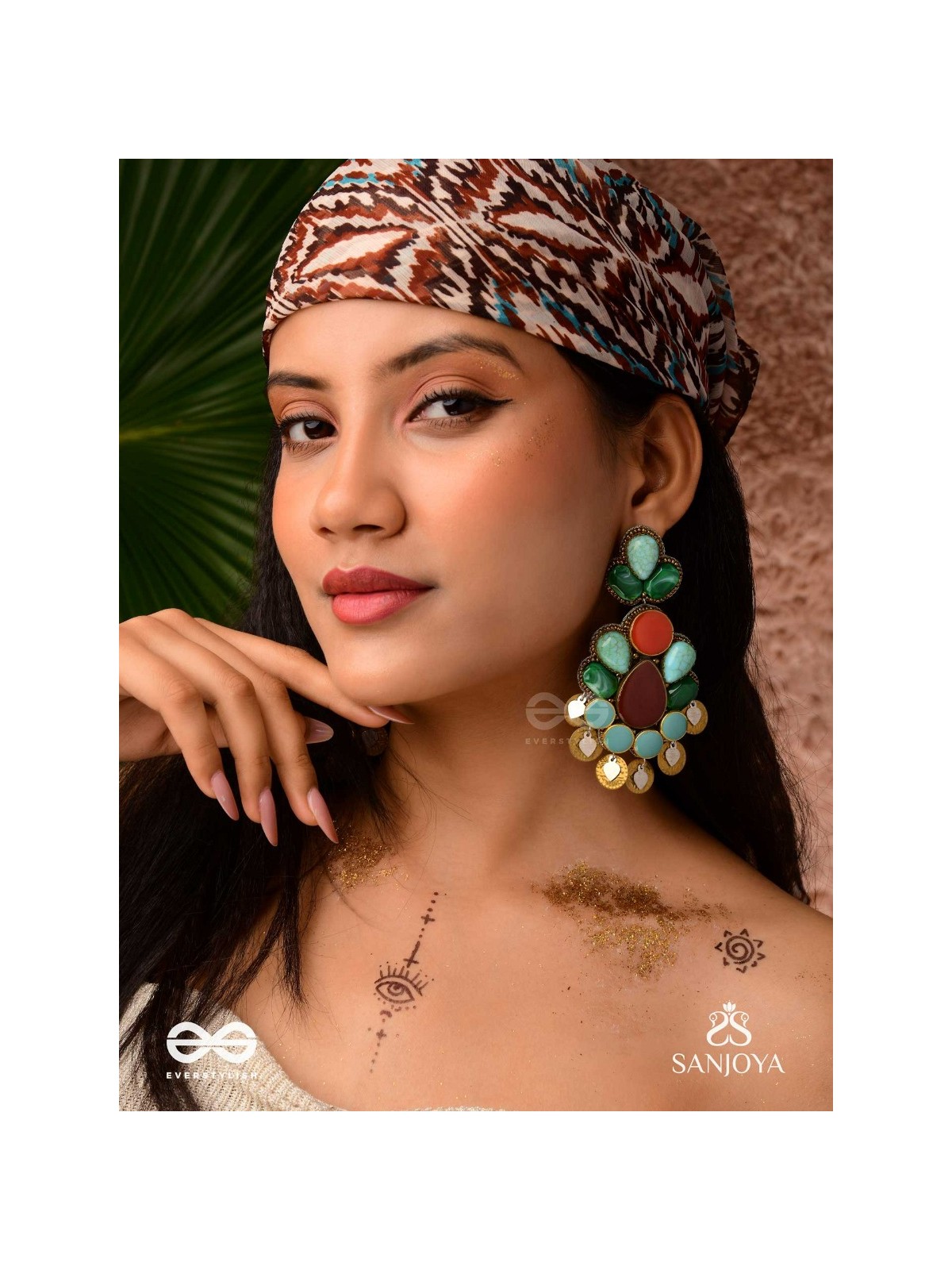 Vikṛtiśīla- Elegant Form-Chunky blue, green, and rust-colored stones with a distinctive golden-silver leaflet design