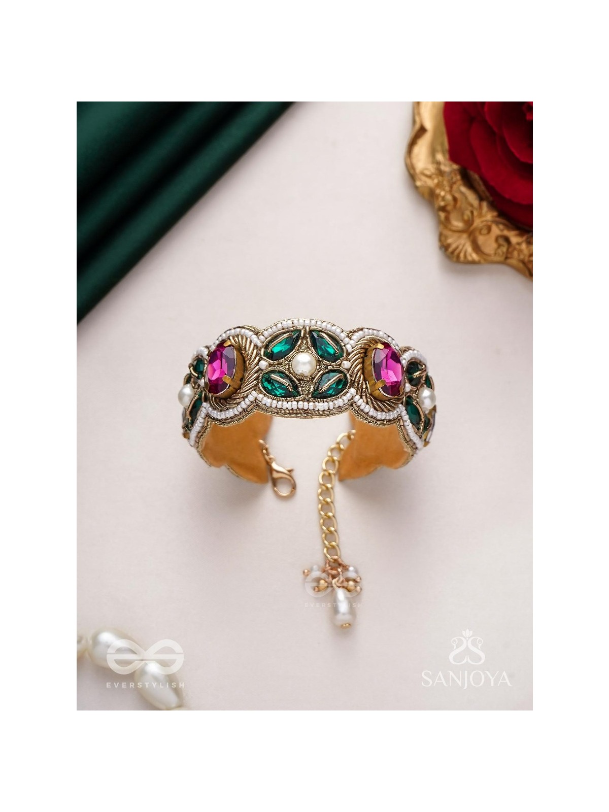 Tarangini-Wavy beauty-opulent bracelet embedded with purple and green stones