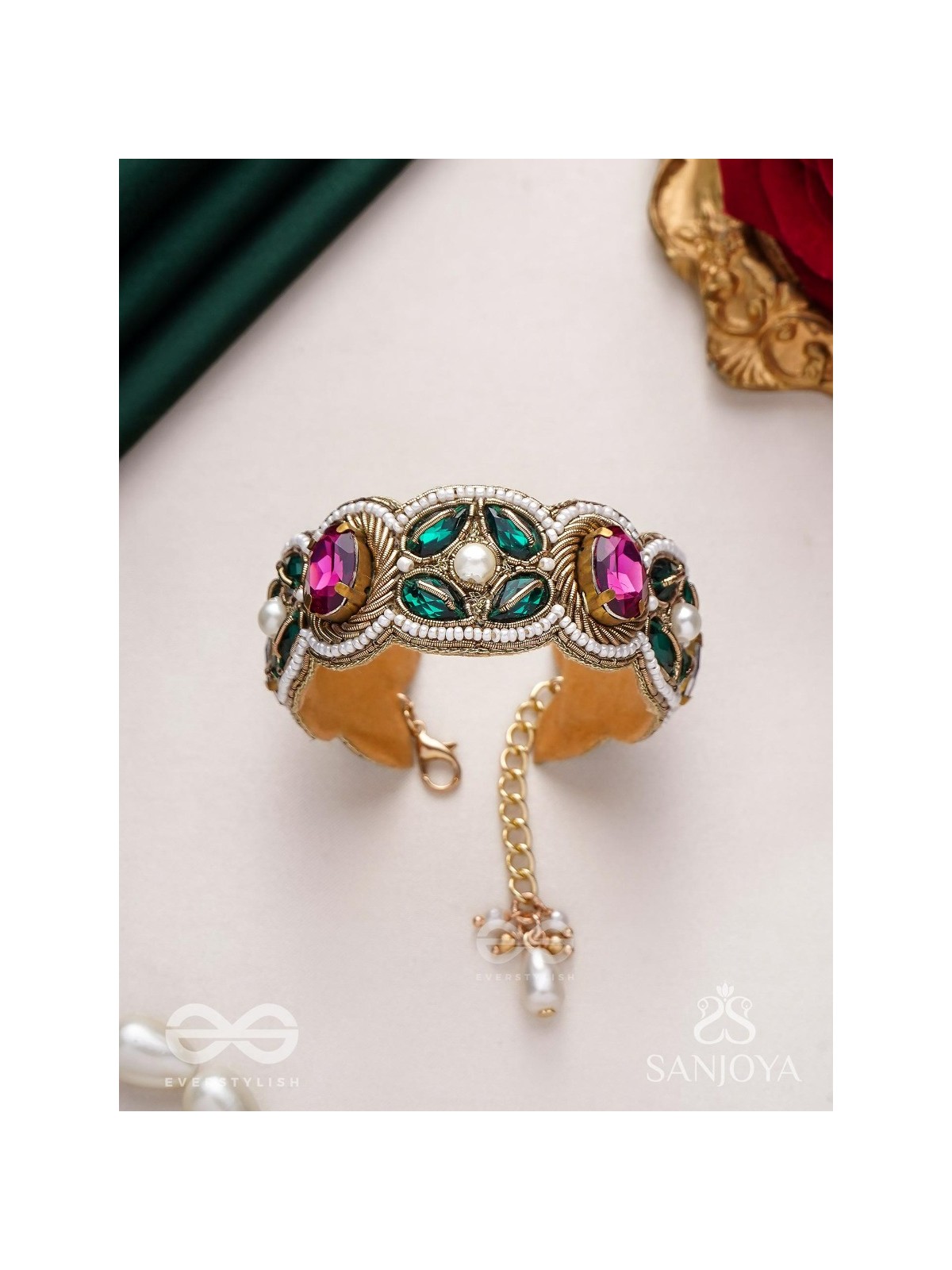 Tarangini-Wavy beauty-opulent bracelet embedded with purple and green stones
