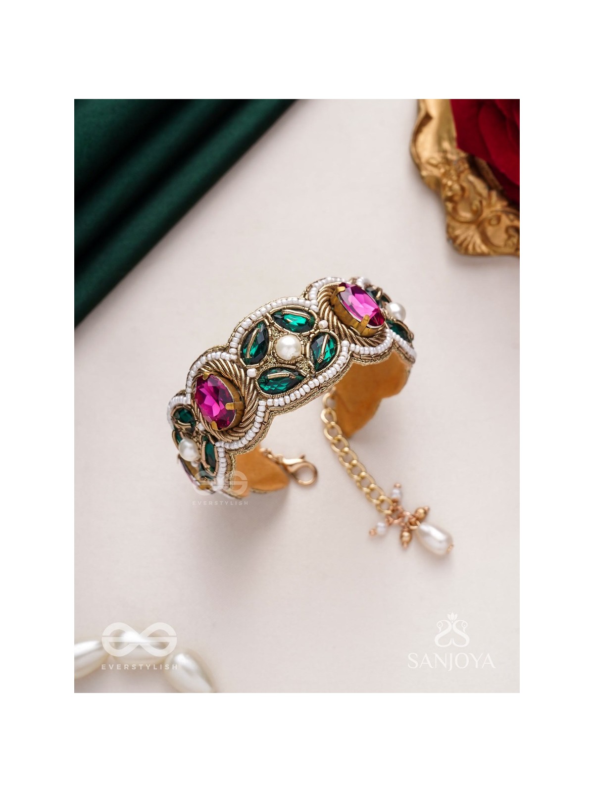 Tarangini-Wavy beauty-opulent bracelet embedded with purple and green stones