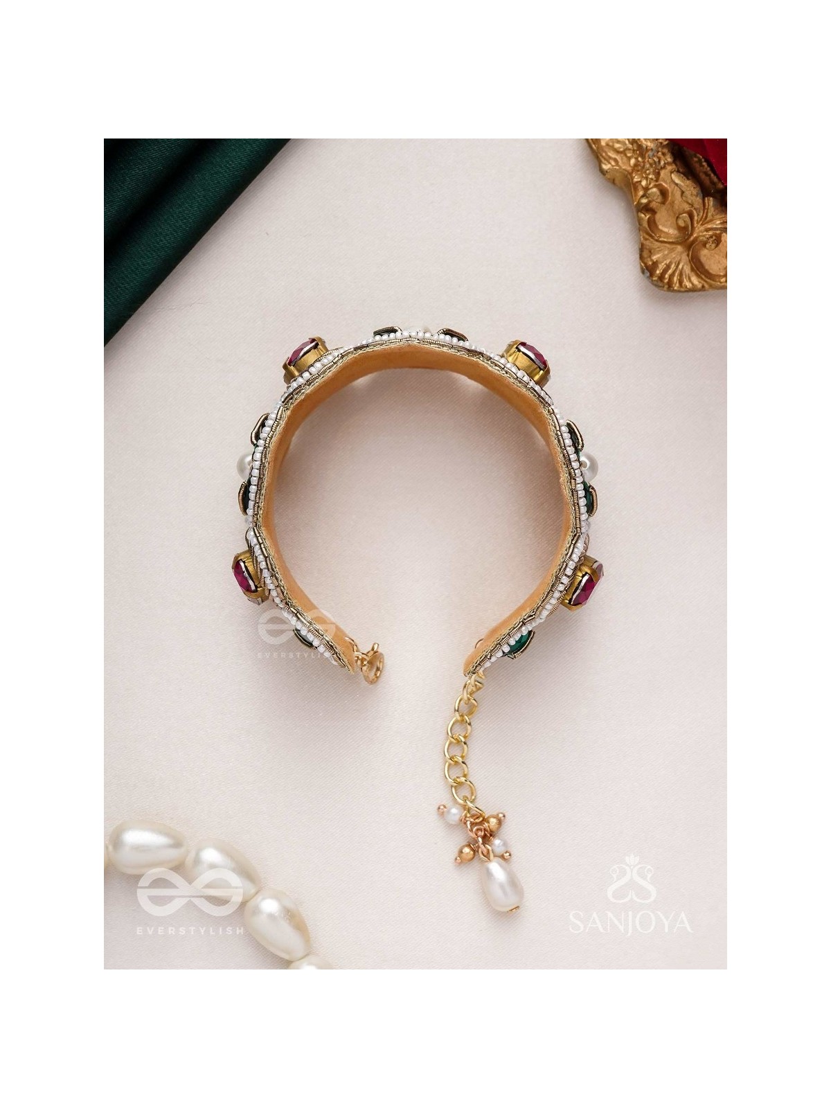 Tarangini-Wavy beauty-opulent bracelet embedded with purple and green stones