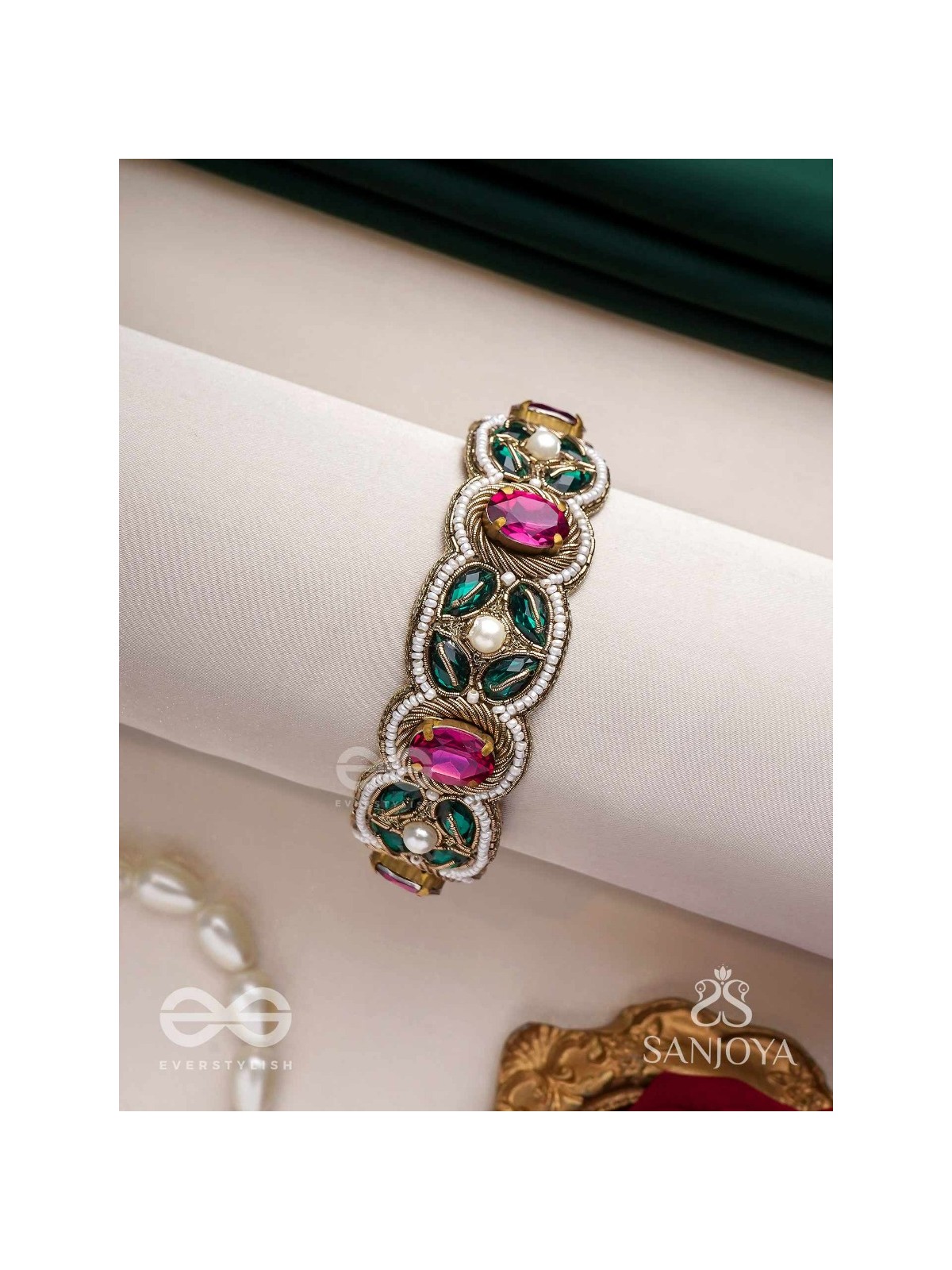 Tarangini-Wavy beauty-opulent bracelet embedded with purple and green stones