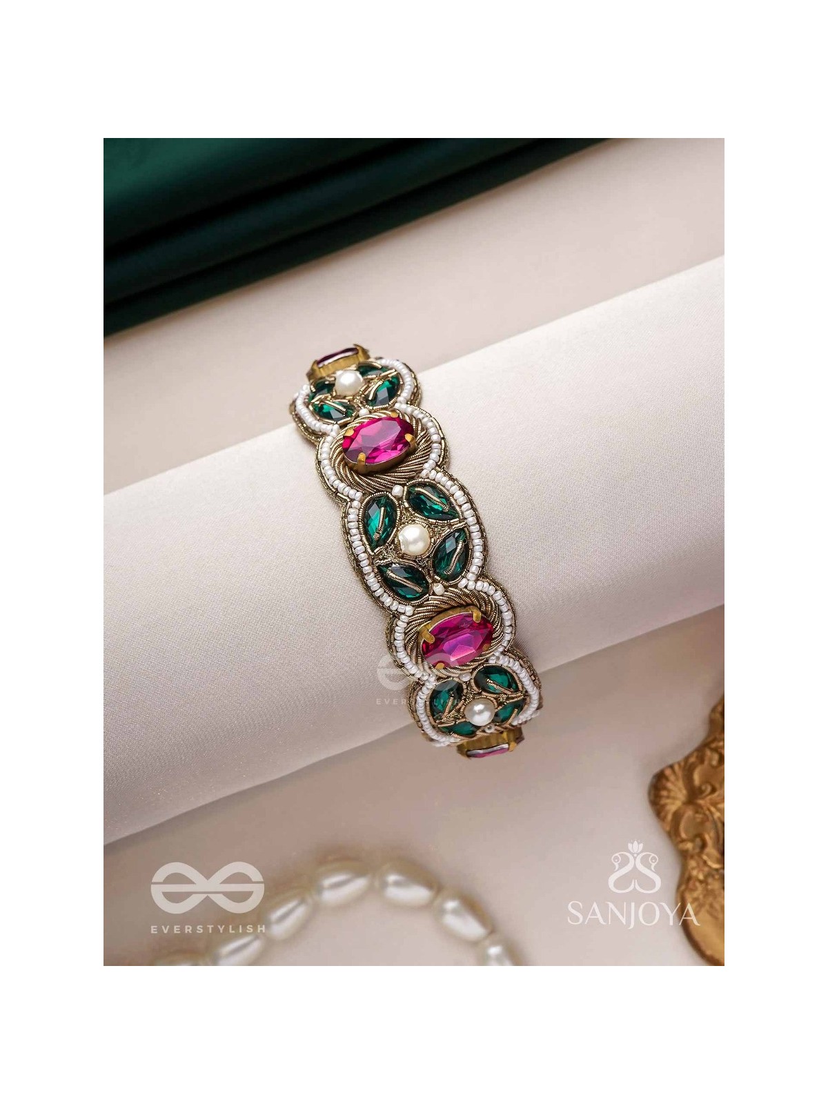 Tarangini-Wavy beauty-opulent bracelet embedded with purple and green stones