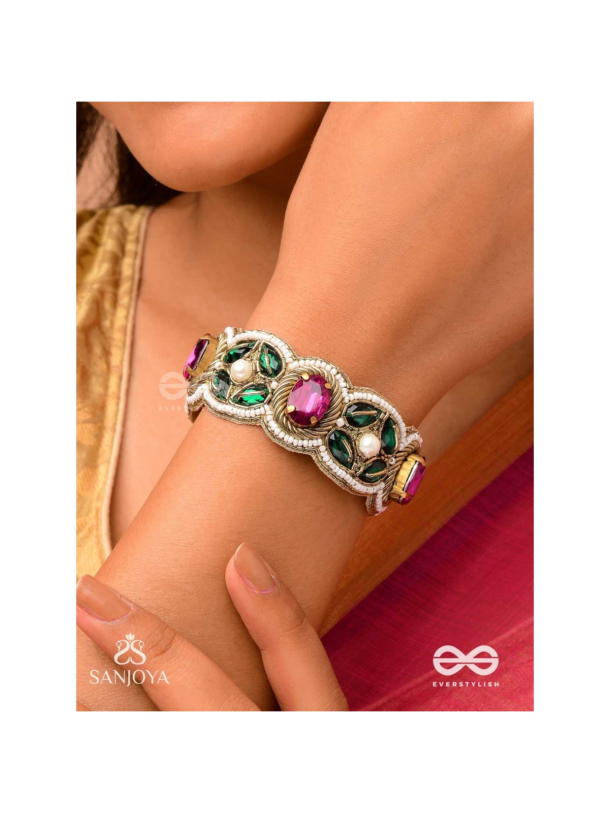Tarangini-Wavy beauty-opulent bracelet embedded with purple and green stones