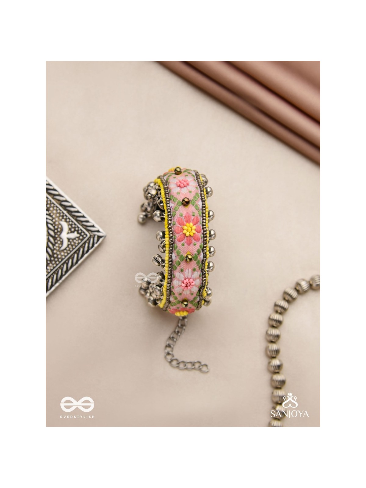 SUMANALEKHA-FLORAL PATTERN- SEMI-OXIDIZED BRACELET FEATURES GHUNGROO, BEADS, AND EMBROIDERED FLOWERS