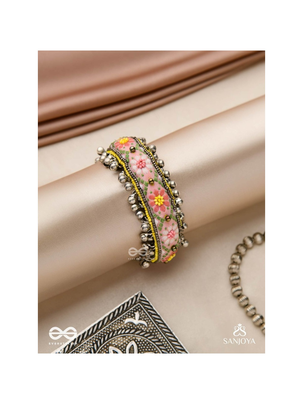 SUMANALEKHA-FLORAL PATTERN- SEMI-OXIDIZED BRACELET FEATURES GHUNGROO, BEADS, AND EMBROIDERED FLOWERS