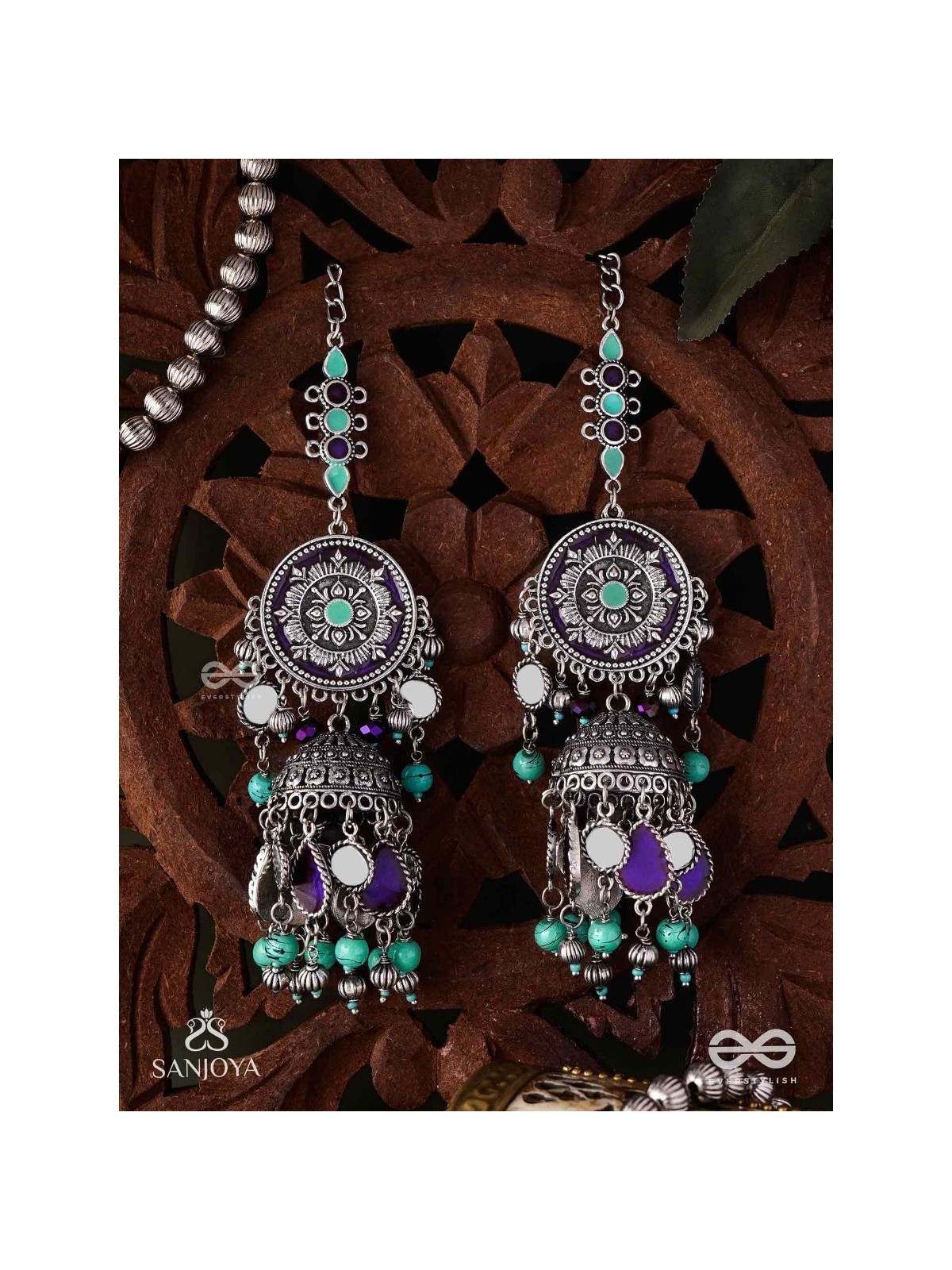 RATNA TILAKA-JEWEL ADORNMENT- EARRINGS ENAMELLED IN SHADES OF BLUE AND BLACK, ACCENTED WITH GHUNGROO BEADS AND OXIDIZED JHUMKI