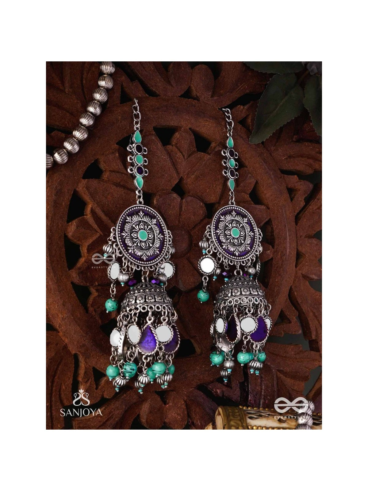 RATNA TILAKA-JEWEL ADORNMENT- EARRINGS ENAMELLED IN SHADES OF BLUE AND BLACK, ACCENTED WITH GHUNGROO BEADS AND OXIDIZED JHUMKI