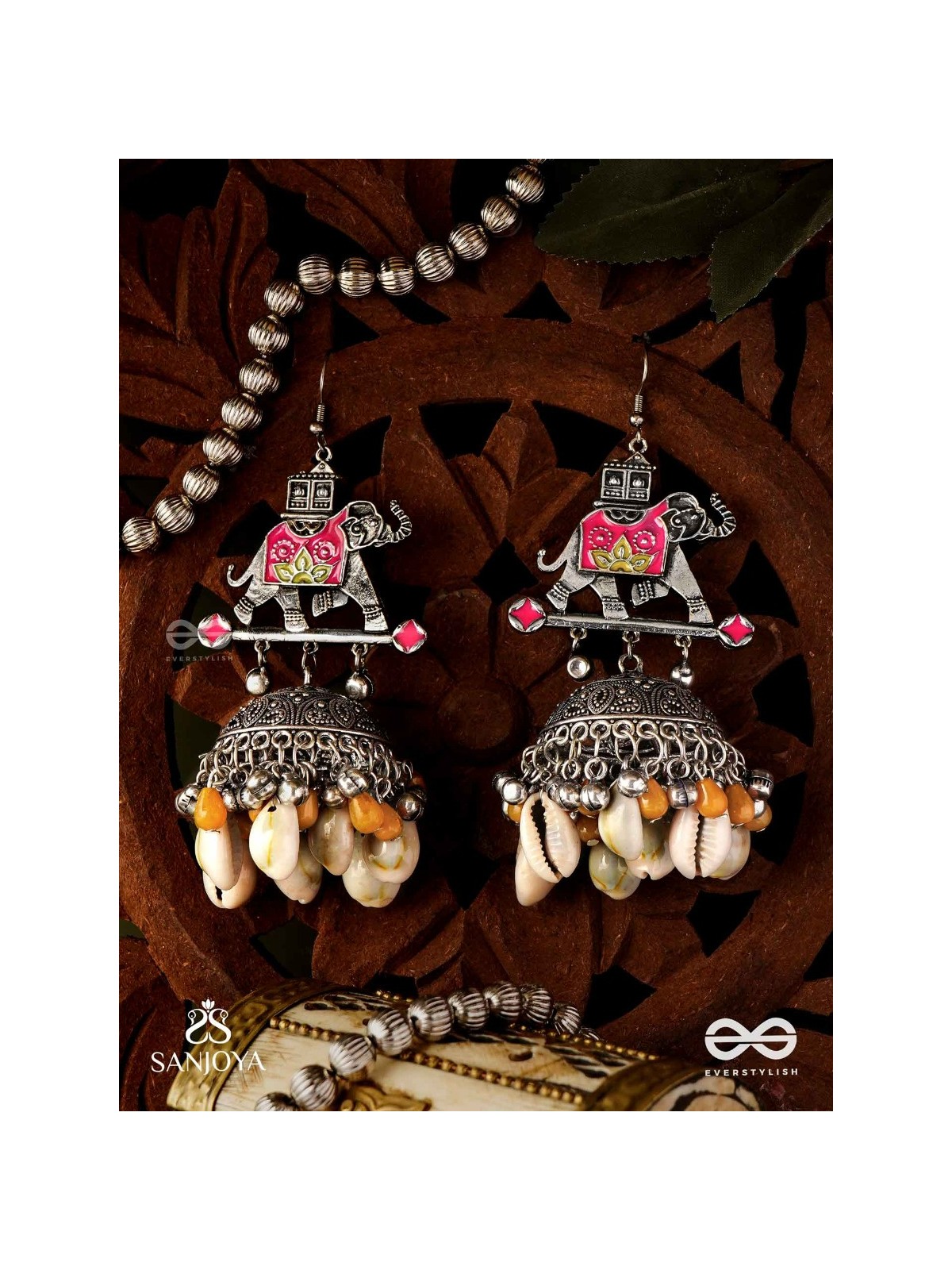 GAJASANKHA KARṆIKA- ELEPHANT-SHELL EARRINGS- OXIDIZED EARRINGS FEATURING AN ELEGANT MOTIF, DELICATE GHUNGHROO'S, AND COWRIE SHELLS